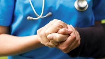 Nurse Holding a Patient's Hand